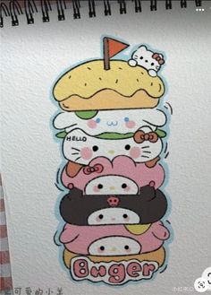 a bunch of hello kitty stickers stacked on top of each other in front of a white wall