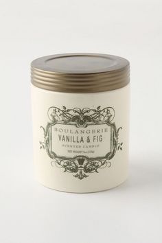 vanilla and fig scented candle in a glass jar with metal lid on white background, front view