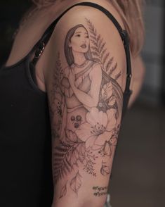 a woman with a tattoo on her arm