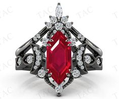 a red stone surrounded by black and white diamonds in an intricately designed ring with accents