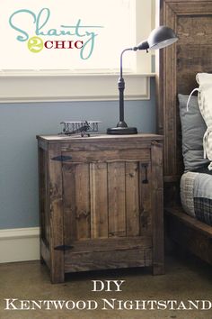 a wooden cabinet sitting next to a bed with pillows on top of it and a window in the background