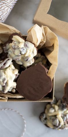 a box filled with chocolate covered cookies on top of a table