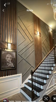 the stairs in this house are decorated with wood paneling and metal handrails