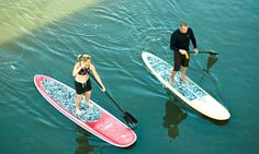 two people on paddle boards in the water