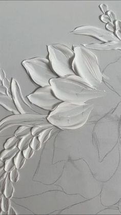 an artistically designed wallpaper with white flowers and leaves