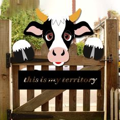 this is an image of a sign with a cow on it that says this is my territory