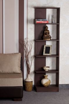 a living room with a chair and a book shelf