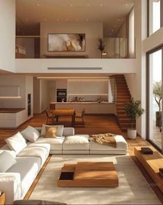 a living room filled with white furniture and lots of wood flooring on top of it