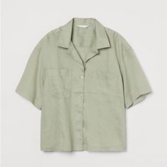 H&M Size L New With Tags Sage Green Short Sleeve Button Up Armpit To Arm Pit: 20” Length: 24.5 H&m Relaxed Fit Shirt With Buttons, H&m Short Sleeve Work Tops, H&m Short Sleeve Tops For Work, Classic Button-up Tops By H&m, Classic Button-up Tops From H&m, Classic Button-up H&m Tops, H&m Collared Shirt With Button Closure, H&m Relaxed Fit Shirt With Button Closure, H&m Tops With Buttons And Relaxed Fit