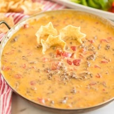 a bowl of soup with tortilla chips on the side