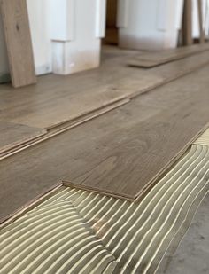 the flooring is being laid out on top of each other and ready to be installed