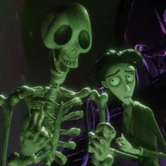 a skeleton and a woman are standing next to each other