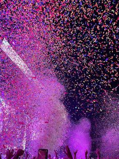 confetti is thrown in the air at a concert