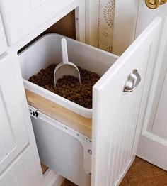 a dog food drawer in the corner of a kitchen