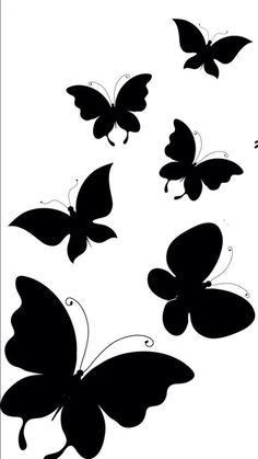 black and white butterflies flying in the air with their wings spread out to reveal different shapes