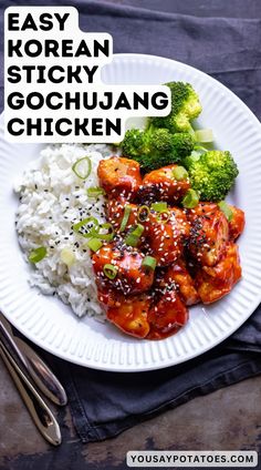 a white plate topped with chicken and broccoli covered in sauce next to rice