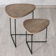 two wooden tables sitting on top of metal legs