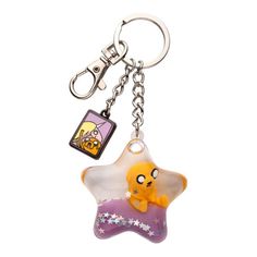 a star shaped keychain with a cartoon character on it's front and back