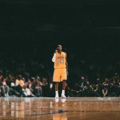 a basketball player is standing on the court