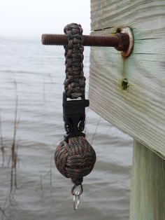 a rope hanging off the side of a wooden dock