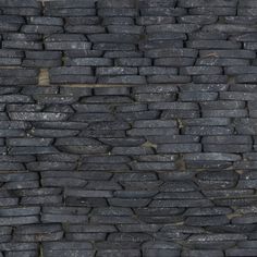 a black stone wall is shown in close up