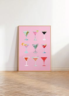 a pink poster with different types of martini glasses on it in front of a white wall