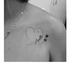 a black and white photo of a woman's chest with the word love written on it