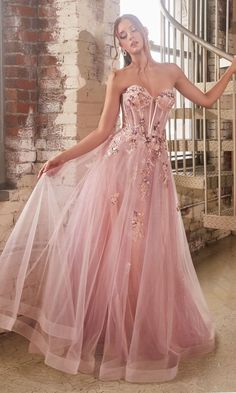 Shimmering floral details make this long pink prom ball gown an eye-catching choice for your formal event. The long pink formal dress has scattered flowers and sparkly embellishments from the sweetheart neckline to the hem. With a sheer corset-style bodice that wraps around to the back, this long pink a-line evening gown gets a sexy vibe for prom, galas, and other formal events. The fully-lined long skirt has a sheer overlay that flows to the floor in an a-line shape that completes the look of t Skirt Movement, Long Ball Dresses, Layered Tulle Dress, Gown Silhouette, Formal Prom Dresses Long, Strapless Evening Gowns, Fairytale Princess, Tulle Balls, Cinderella Divine