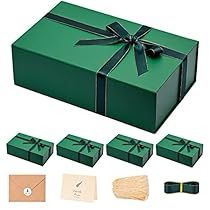 an open green gift box with ribbon and other items to make it look like they are wrapped in paper