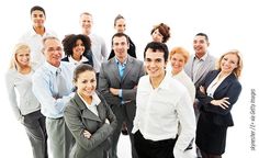 a group of business people standing together in front of a white background with their arms crossed