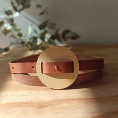 Add a touch of natural elegance to your wardrobe with our handmade leather belt featuring a beautifully crafted wooden buckle. 🌿 Why You'll Love It: Unique Design: The combination of sleek leather and a rustic wooden buckle creates a modern, eye-catching accessory Handcrafted Quality: Meticulously made to ensure durability and a perfect fit Versatile Style: Complements both casual and formal outfits, adding a stylish twist to any ensemble ---- The buckle is made of multilaminated guatambú wood (4 mm thick), protected with lacquer to ensure long-lasting durability. The measurement of the belt is taken from the bronze buckle clasp to the hole. The distance between buttonholes is 5 cm Measures: Adjustable length that goes from 60 cm (23.62 in) to 110 cm (43.31 in ) (from the bronze clasp to Wooden Belt Buckle, Handmade Belt, Presents For Wife, Handmade Leather Belt, Handmade Belts, Belt For Women, Formal Outfits, Unique Gifts For Her, Suspender Belt