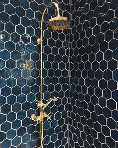 the shower head is gold in color