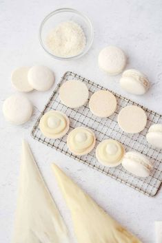 some cookies are on a cooling rack next to other ingredients