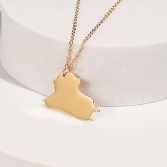 Honor your connection to Iraq with this exquisitely crafted Iraq Map Pendant Necklace. The pendant features a detailed silhouette of the country, capturing its unique shape with precision and elegance. Hanging from a delicate chain, this necklace adds a touch of sophistication and charm to any outfit. Perfect for both everyday wear and special occasions, it makes a meaningful and stylish statement. This necklace also serves as a thoughtful gift for anyone with a connection to or appreciation for Iraq Necklace, Iraq Map, Map Pendant, Golden Necklace, Delicate Chain, Gold Pendant Necklace, Iraq, Ring Bracelet, Size 20