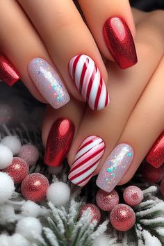 Get festive with these classic red and white candy cane nails featuring a stunning glitter accent! The traditional stripes shine brightly with an eye-catching glitter finish on the accent nails, making your manicure pop while keeping it chic and stylish. Perfect for holiday parties or cozy gatherings, these nails are a sweet way to celebrate the season! 🎄✨💅 #NailArt #CandyCaneNails #GlitterNails #ChristmasNailDesigns #HolidayNailInspo Winter Nails Candy Cane, French Candy Cane Nails, Red Candy Cane Christmas Nails, Christmas Nail Art Designs 2024, Holiday Nails Coffin Christmas, Candy Cane Nails Simple, Chrome Candy Cane Nails, Candy Cane Snowflake Nails, Red Christmas Present Nails