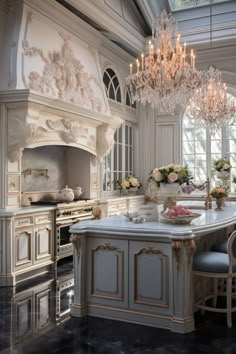 an elegant kitchen with chandelier and marble counter tops in the middle of it