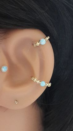 a close up view of a fake ear with blue stones on it's sides