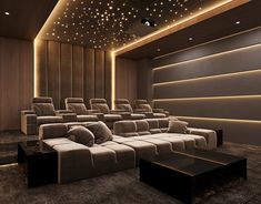 an empty movie theater with seats and lights on the ceiling is shown in this image