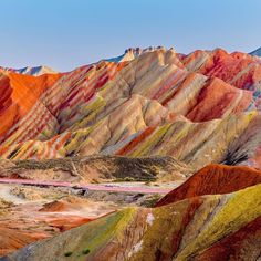 the colorful mountains are painted with different colors