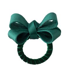 a green hair tie with a bow on it