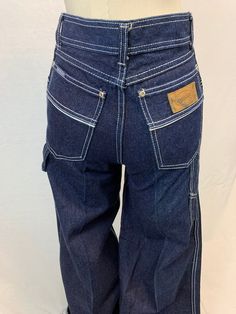 I remember having these in the 70's.  The hems were super long so you could hem them yourself to match the platform shoes you would be wearing.  These are tiny but would make a big statement. Bust, Waist, and Hip measurements are with the garment laid flat, seam to seam. Please be certain to compare against your own measurements with a garment that fits well. All listed measurements are approximate. Every vintage piece has been pre-loved and chosen for its unique qualities. Fading and wear + tea Vintage High Waist Denim Cargo Jeans, Retro Wide Leg Denim Cargo Jeans, 90s Style Fitted Wide Leg Flare Jeans, Wide Leg Retro Jeans, Vintage Dark Wash Straight Leg Cargo Jeans, 1970s Style Wide Leg Jeans, Retro Dark Wash Wide Leg Flare Jeans, Vintage Straight Leg Dark Wash Cargo Jeans, Retro Wide-leg Denim Cargo Jeans