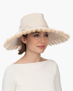 If you are looking for a woman's sun hat for sale online that is sure to turn heads, look no further! Named from the Caribbean Island that has endless beaches and warm turquoise water, this sun hat made of Squishee®, is a show stopper. This flirty, tropical sun hat combines the pinched crown of a fedora with a wide brim, edged all around with glamorous straw fringe. Wherever you adventure, from St. Barths to Antibes, approving smiles are sure to follow! Squishee® straw is a sustainable man-made Upf 50+ Fedora For Kentucky Derby Vacation, Upf 50+ Fedora For Kentucky Derby And Beach, Upf 50+ Fedora For Beach And Kentucky Derby, Upf 50+ Hats For Pool, Sun Hats With Upf 50+ For Vacation, White Sun Hats For Travel, Cream Sun Hat For Warm Weather, Cream Wide Brim Hat For Vacation, Lightweight Short Brim Hat For The Pool