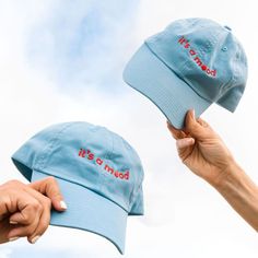 Bad mood, good mood—regardless, it's a mood. Share your cyclical mood by sporting our ﻿It's a Mood﻿ dad hat. One size. Made from 100% cotton. Clothing Product Shots, Merch Shoot, Hat Photoshoot, Clothing Photoshoot, Camping Hat, Cap Store, Brand Ideas, Op Shop, Spring 2025