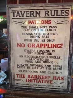 a sign that is on the side of a building saying tavern rules and no crapping