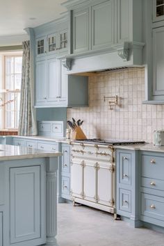 Gray kitchen cabinets with white subway tile backsplash and stainless steel appliances, showcasing a sophisticated, modern style. #CoolToneKitchenCabinets #TheKitchen #KitchenCabinetColorIdeas #SophisticatedDesign Gray Kitchen Cabinets, Vibrant Kitchen, Inviting Kitchen, Gray Cabinets