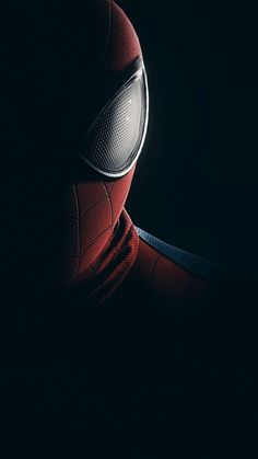 spider - man in the dark with his head turned to look like he is wearing a mask