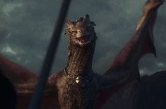 a close up of a dragon with its mouth open