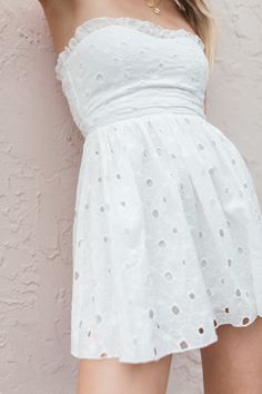 FINAL SALE!Our Lainey Eyelet Mini Dress has a strapless, sweetheart design with delicate ruffle detailing and a zipper closure. True to Size 100% Cotton Lined Hand Wash, Hang Dry Summer Dress With Ruffle Hem, White Bandeau Mini Dress For Spring, Spring Bandeau Dress With Ruffles, Spring Strapless Dress With Sweetheart Neckline For Day Out, Feminine Strapless Dress For Spring Day Out, Strapless Lined Dress For Daywear, Feminine Strapless Dress With Sweetheart Neckline For Brunch, Spring Strapless Dress For Casual Occasions, Spring Strapless Bandeau Dress With Ruffles