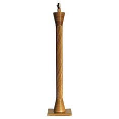 a tall wooden candle holder on a white background