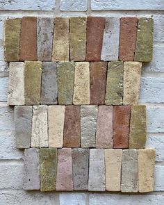 a brick wall with different colored bricks on it